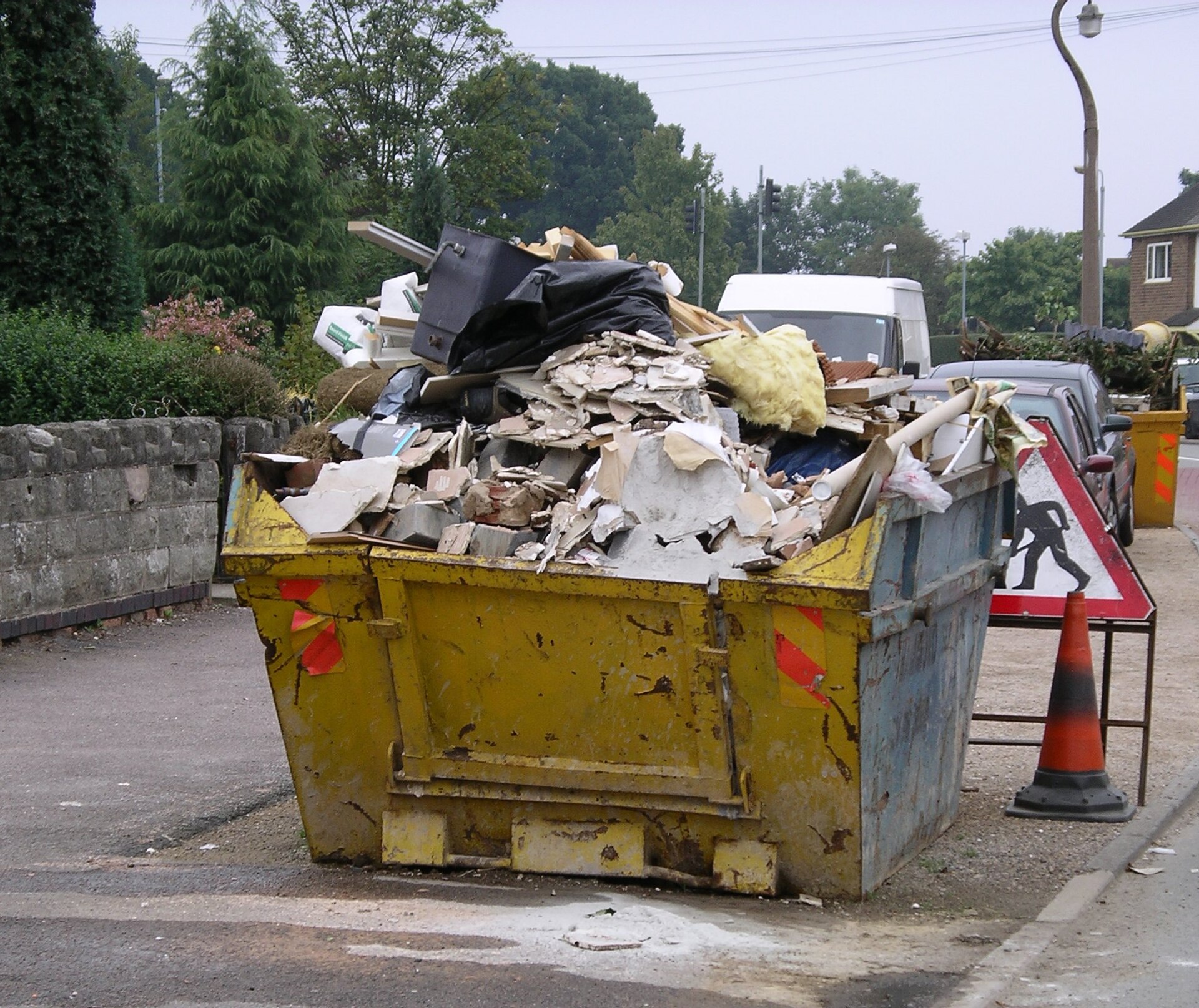 Open skip container holding mixed discarded materials