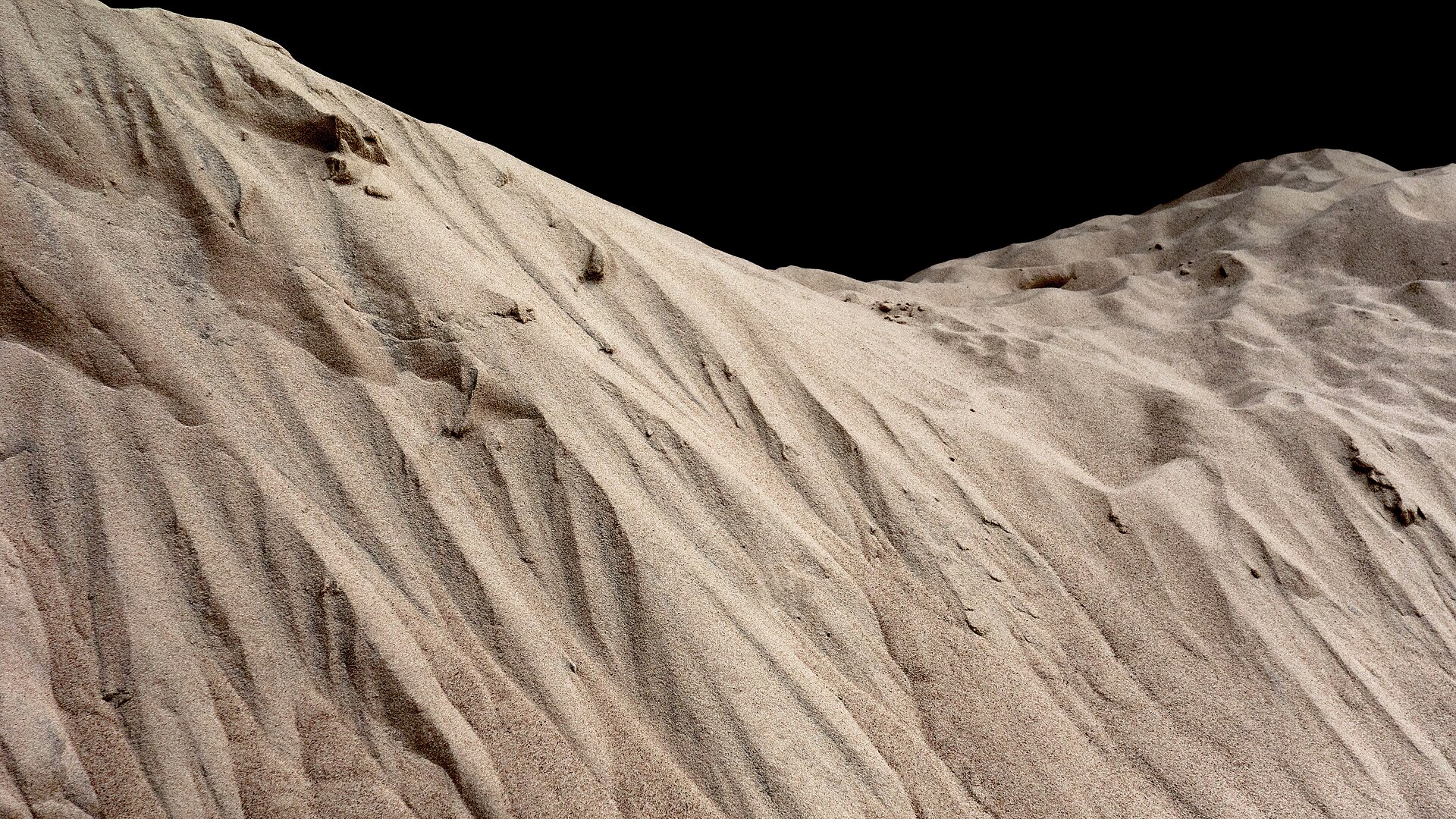 Close-up of pale mineral sand used as stabilising infill
